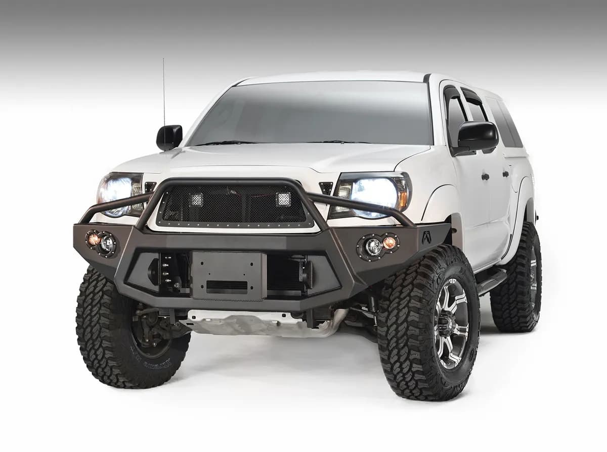 Premium Heavy Duty Winch Front Bumper; 2 Stage Black Powder Coated; w/Pre-Runner Grill Guard; Incl. 1in. D-Ring Mts./Light Cut-Outs w/Hella 90mm Fog Lamps/60mm Turn Signals;