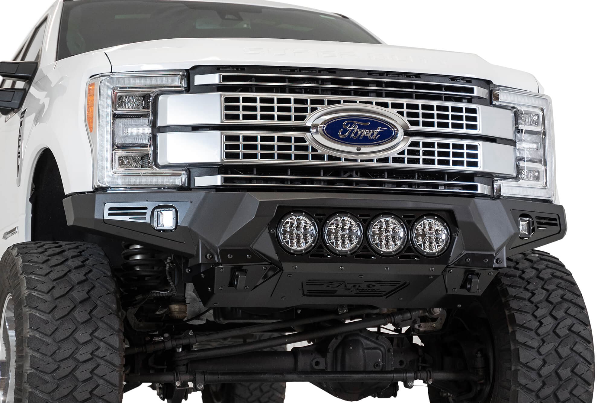 Addictive Desert Designs The Addictive Desert Designs Bomber front bumper brings the ultimate combination of form and function to the Ford F250F350. A full 316 aluminum skid plate offers superior protection while keeping the bumper lightweight. Three different light options ar